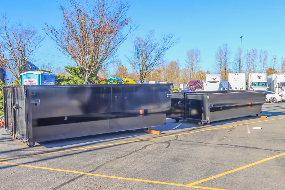 Professional dumpster rental service with roll-off container on residential driveway in Santa Fe